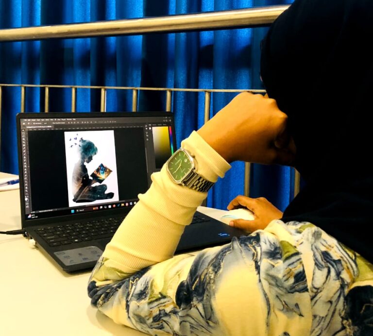 A freelance digital marketing consultant who is working with a laptop in an office atmosphere